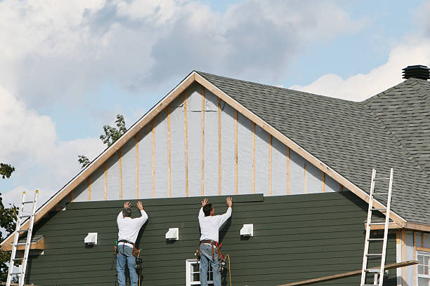 Professional Vinyl Siding technician working in Lowell, IN